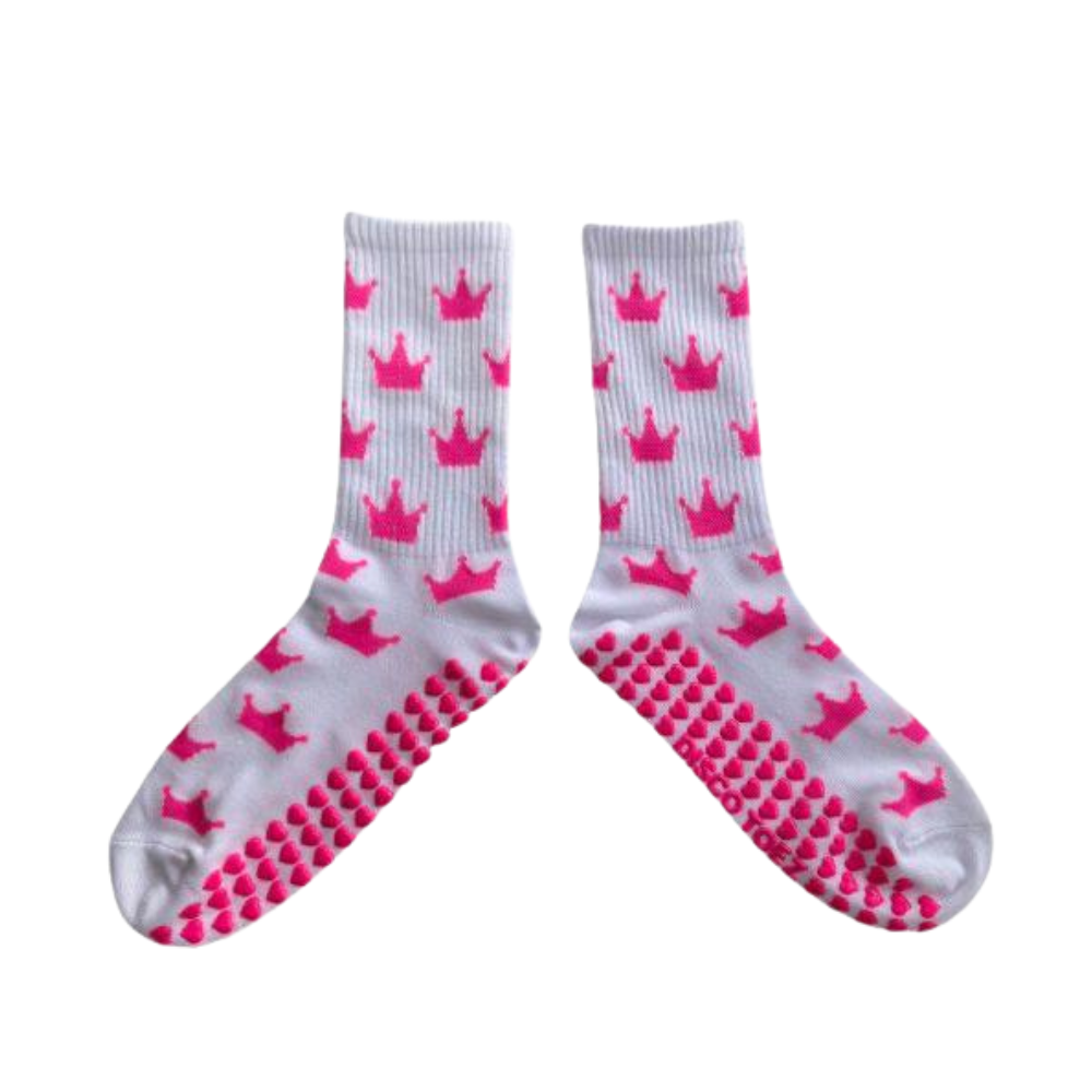 White socks with pink crowns and textured sole on a white background