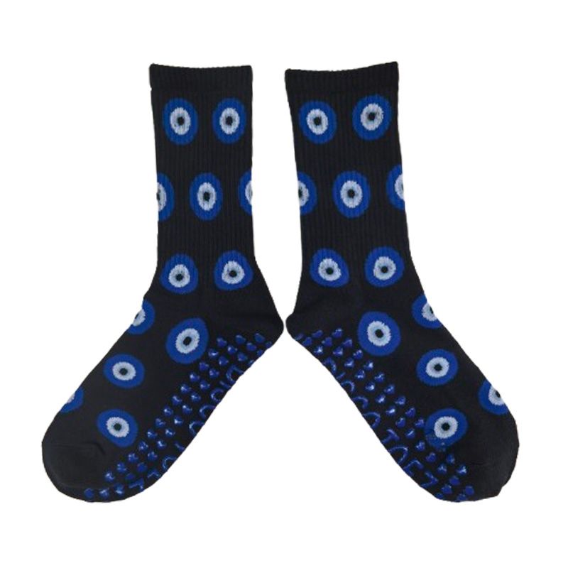 Black socks with blue and white circular patterns on a white background