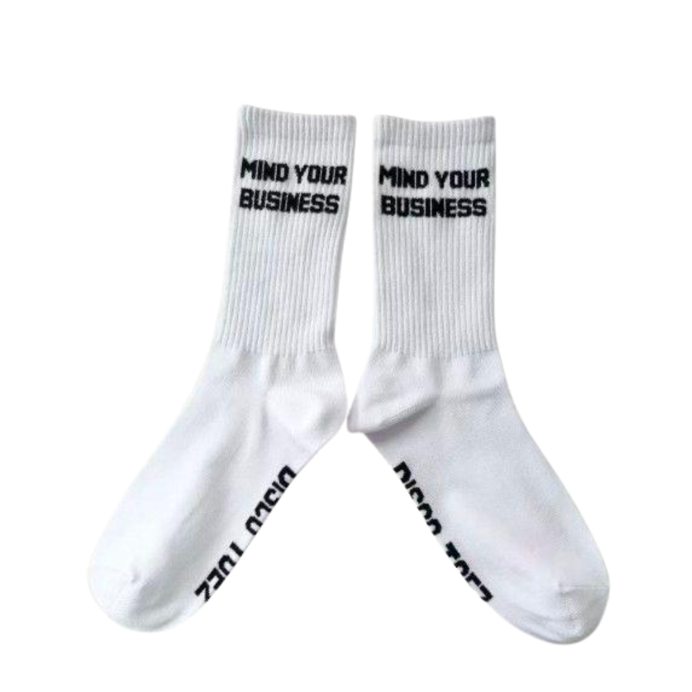 White socks with 'Mind Your Business' text on a white background