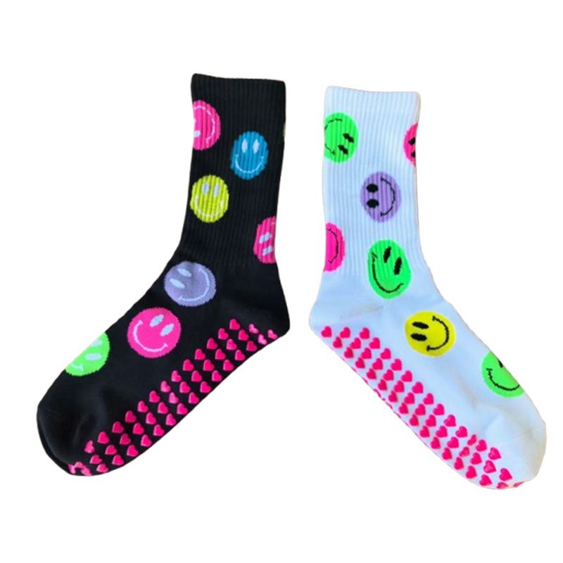 Two socks with smiley face patterns on a white background
