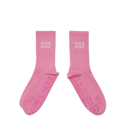 Pair of pink socks with '333' print on a white background
