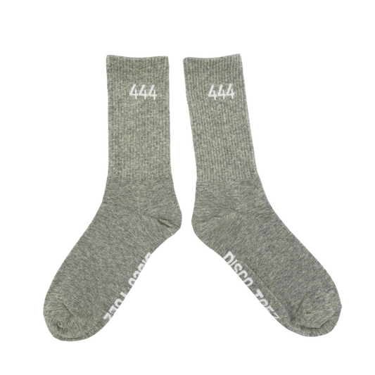 A pair of gray socks with white text '444' on a white background