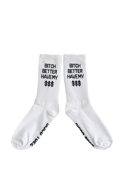 A pair of white socks with black text 'bitch better have my $$$' on a white background