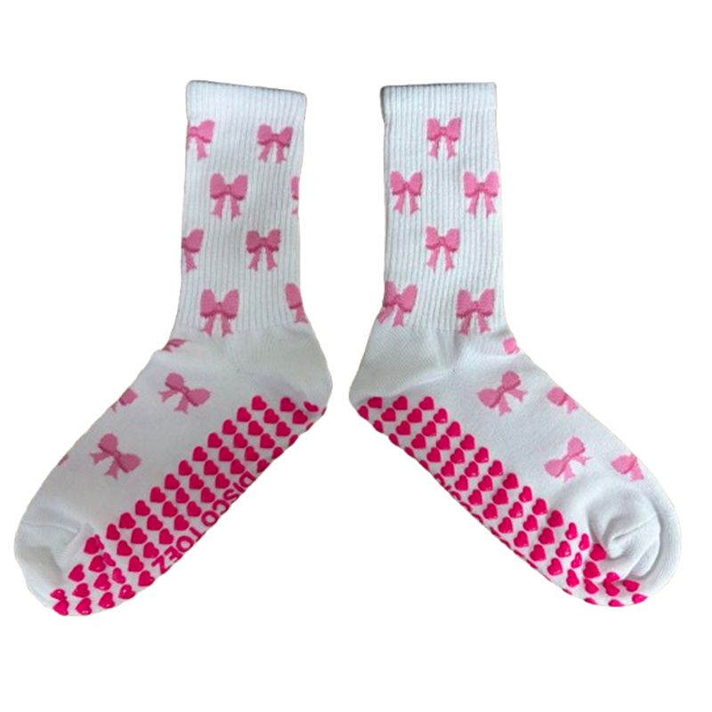 White socks with pink bows and patterns on a white background