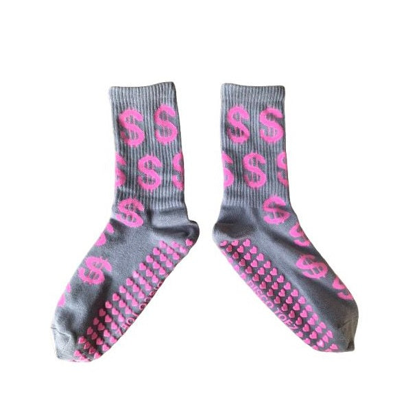Gray socks with pink dollar sign pattern on a white background