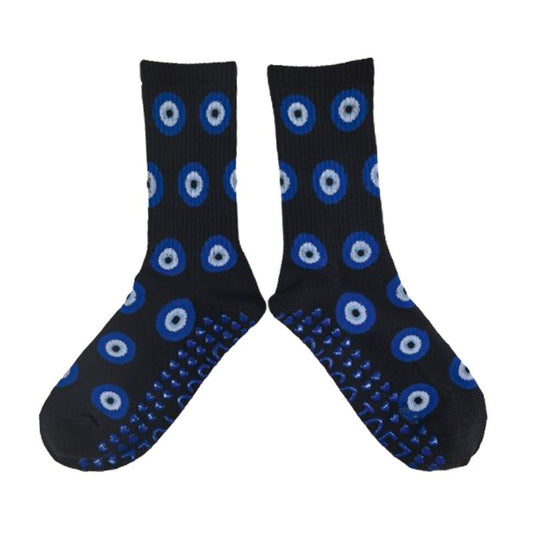Black socks with blue and white circular patterns on a white background