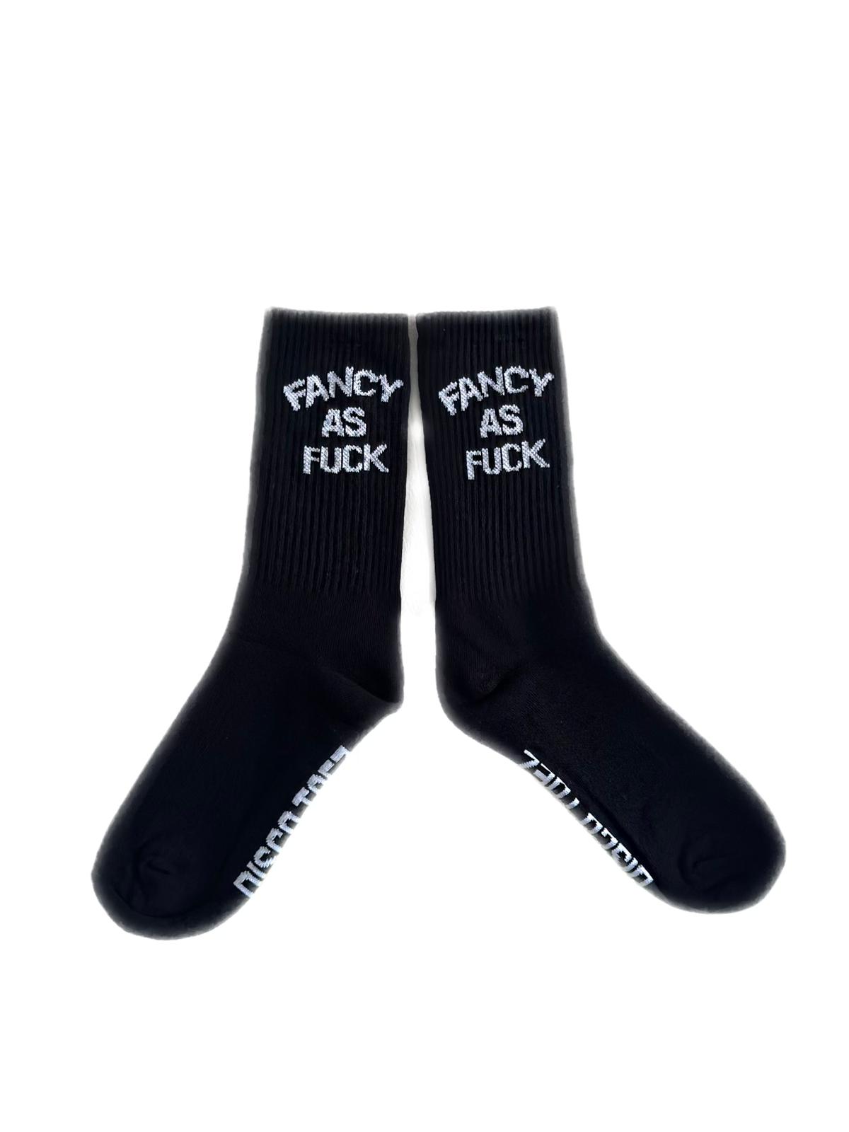 A pair of black socks with white text 'fancy as fuck'