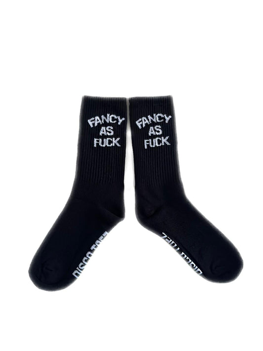 A pair of black socks with white text 'fancy as fuck'
