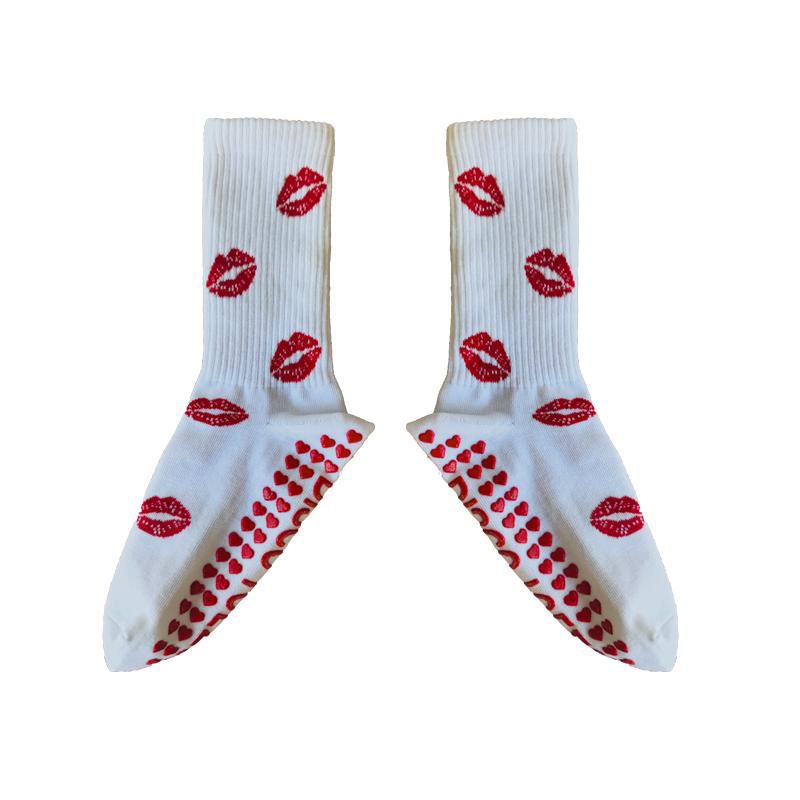 White socks with red lip prints on a white background