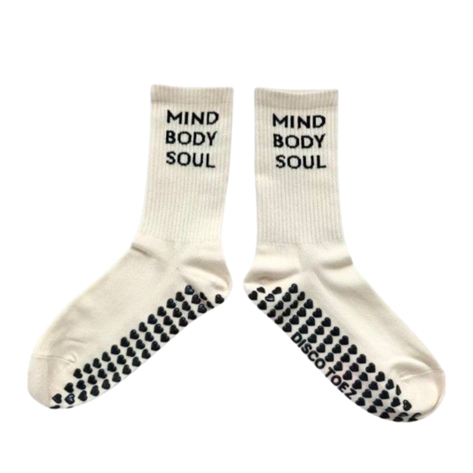 Pair of tan socks with 'Mind Body Soul' text and black sole patterns on a white background
