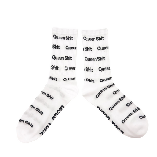 A pair of white socks with black text 'queen shit' printed all over