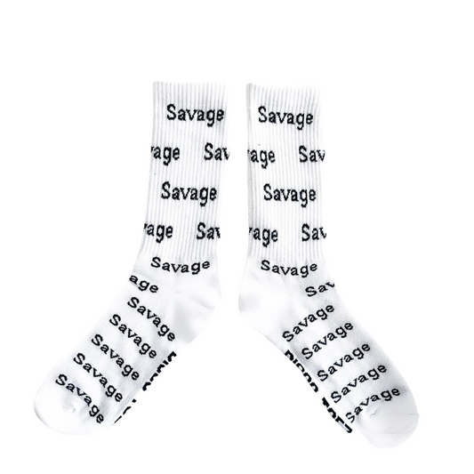 A pair of white socks with black text 'Savage' printed all over
